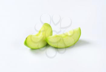 Fresh green apple wedges - studio shot