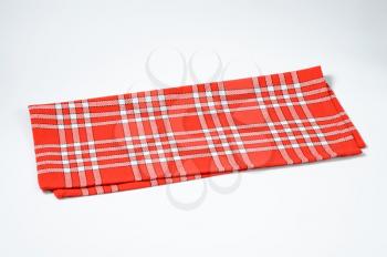 folded checked red and white napkin