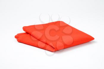 Folded red cloth place mat