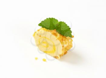 Soft cheese rolled in pineapple pieces and choppedalmonds