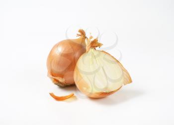 one and a half raw onion on white background