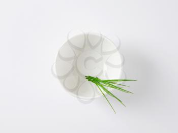 fresh chives in white bowl