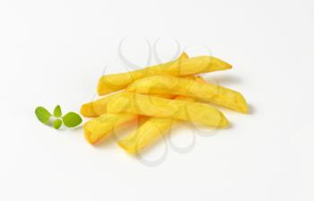 handful of French fries on white background