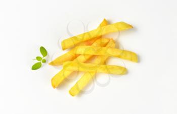 handful of French fries on white background
