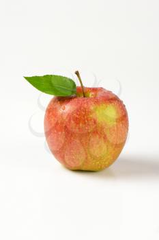 washed red apple on white background
