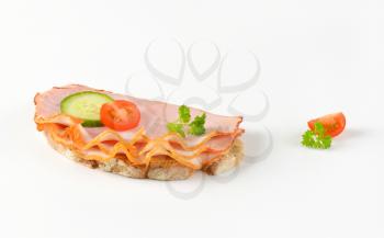 bread with thin slices of ham