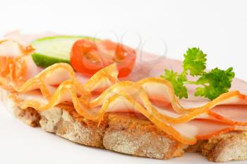 bread with thin slices of ham