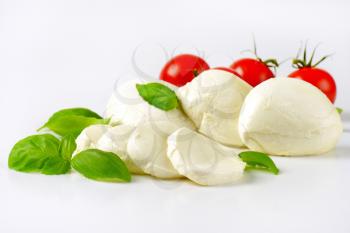 close up of mozzarella, cherry tomatoes and fresh basil - ingredients for caprese salad
