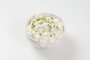 bowl of creamy cheese spread with chives