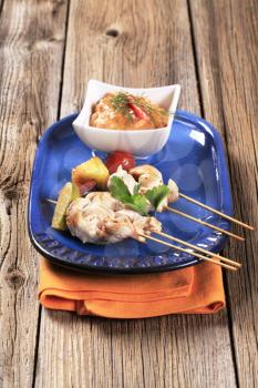 Chicken skewers and vegetable dipping sauce