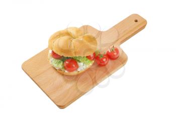 bulkie roll with cottage cheese, lettuce and  cherry tomatoes