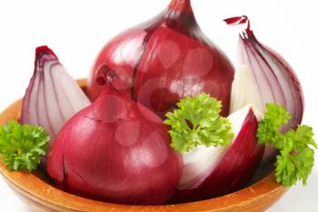 whole and quartered red onions