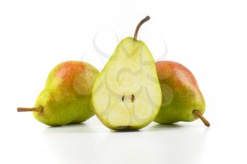 two and half ripe pears on white background