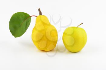 yellow pear and yellow apple on white background