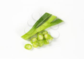 chopped green onion on white background