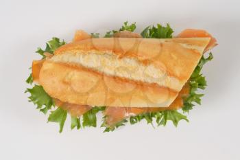 sandwich with smoked salmon on white background