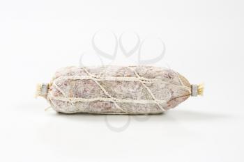 French dry cured sausage on white background