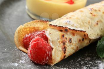Crepe filled with fresh raspberries