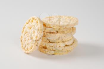stack of puffed rice bread slices on white background