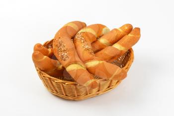 scuttle of fresh bread rolls on white background