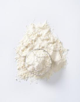 bowl of wheat flour on white background