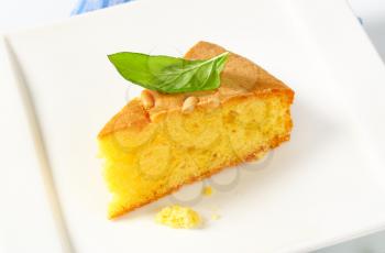 Slice of butter sponge cake on white background
