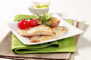 Pan fried fish fillets with roasted potato