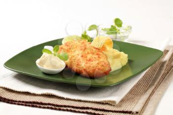 Fried breaded fish served with mashed potato