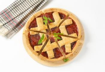 sliced strawberry jam tart with lattice on top