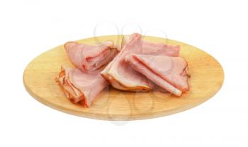 slices of pork ham on oval wooden cutting board