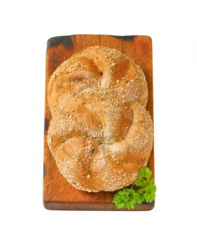 two whole wheat buns on wooden cutting board