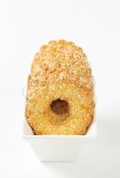 Bowl of ring-shaped cookies topped with granulated sugar
