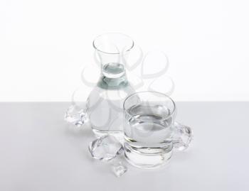 carafe and glass of fresh water with ice