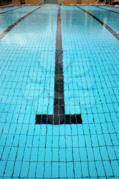 Above view of quiet water surface and lane in swimming pool