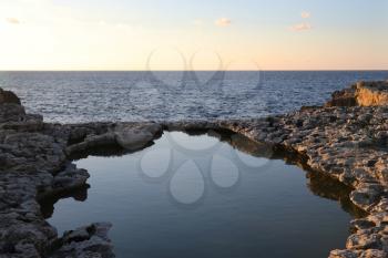 Rock pool and view of the sea from the shore of Malta