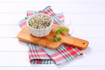 bowl of wild rice on wooden cutting board