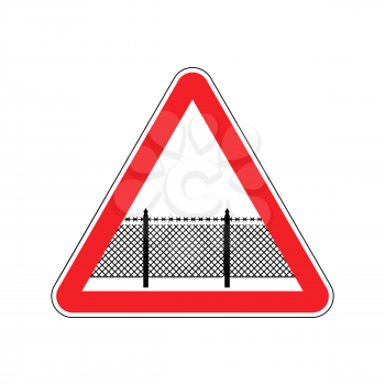 Warning sign attention with barbed wire fence. Note border on road. Road red symbol interdiction zone