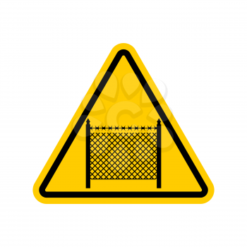 Warning sign symbol with barbed wire fence. Note border on road. Road yellow sign interdiction zone