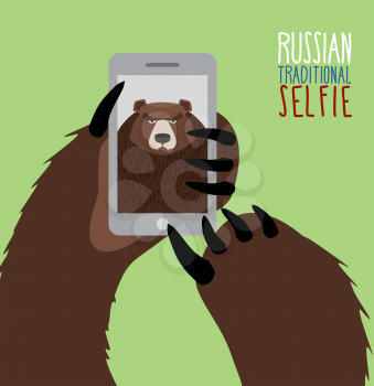 Selfie in Russia. Bear selfie. Bear paw holding a phone. Russian traditional ornament