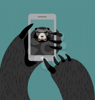 Bear selfie. Grizzly photographed themselves on phone. Angry wild animal and smartphone
