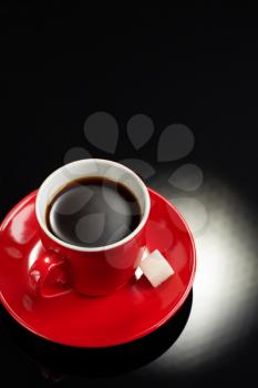 cup of coffee on black background