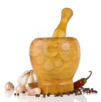 garlic, pepper in mortar and pestle isolated on white background