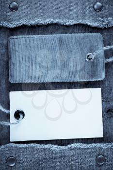 blue jean and price tag on wood texture background