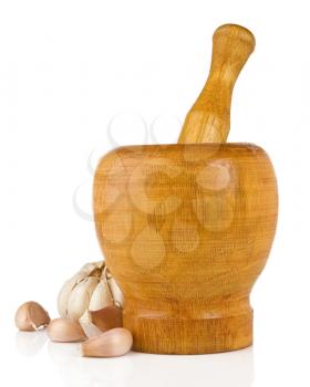 garlic in mortar and pestle isolated on white background