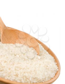some rice in wooden plate and spoon isolated on white background