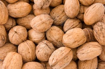 whole walnuts as background