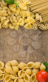 raw pasta and food ingredient at wood background