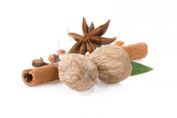 cinnamon sticks, anise star and nutmeg isolated on white background