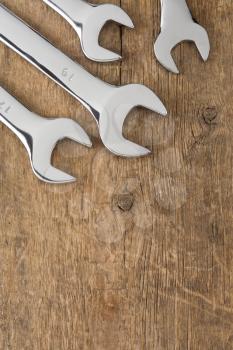 wrench tool on wood background