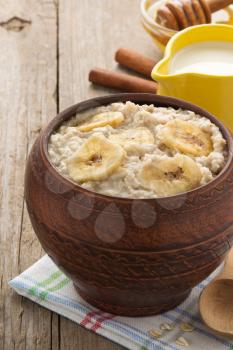bowl of oatmeal on wood background